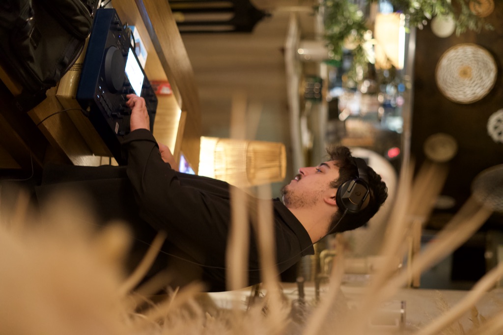 Helena Modern Riviera with DJ booth as element within the restaurant, pampas installation overhead